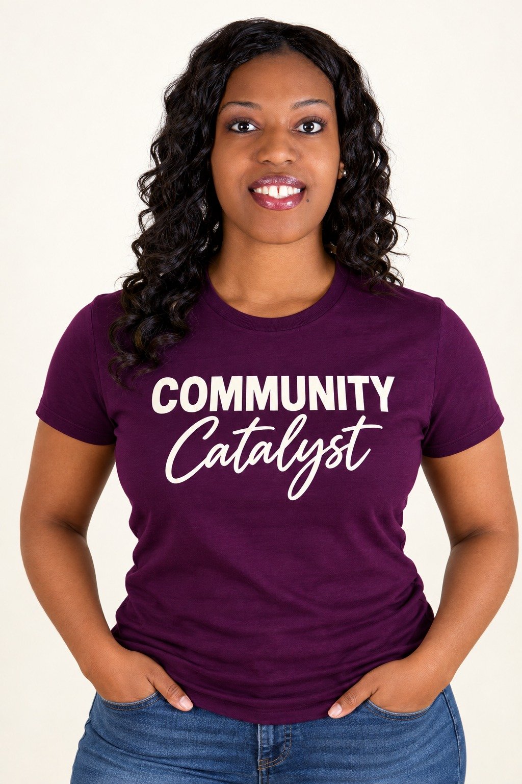 Regina E. Coley wearing a purple Community Catalyst T-shirt